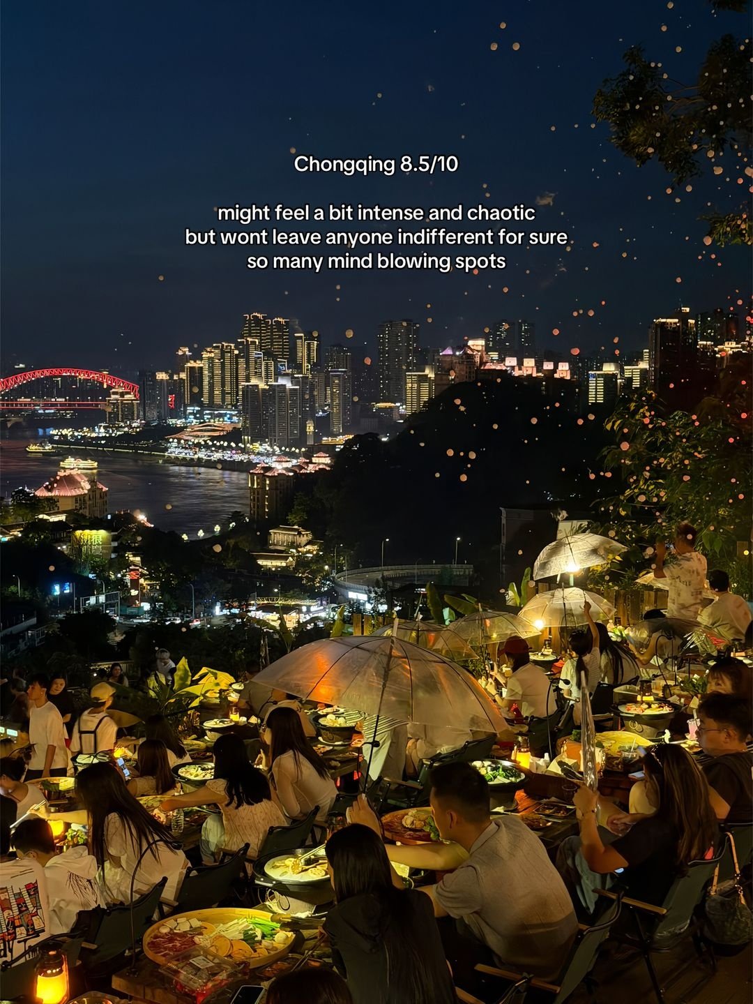Night dining terrace overlooking Chongqing’s illuminated skyline