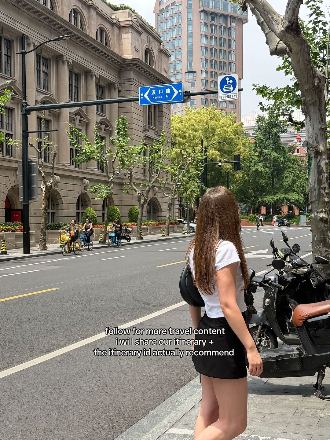 Traveller exploring a leafy street in central Shanghai