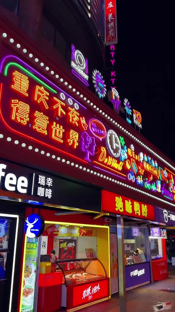Colourful neon restaurant façades and food counters at street level