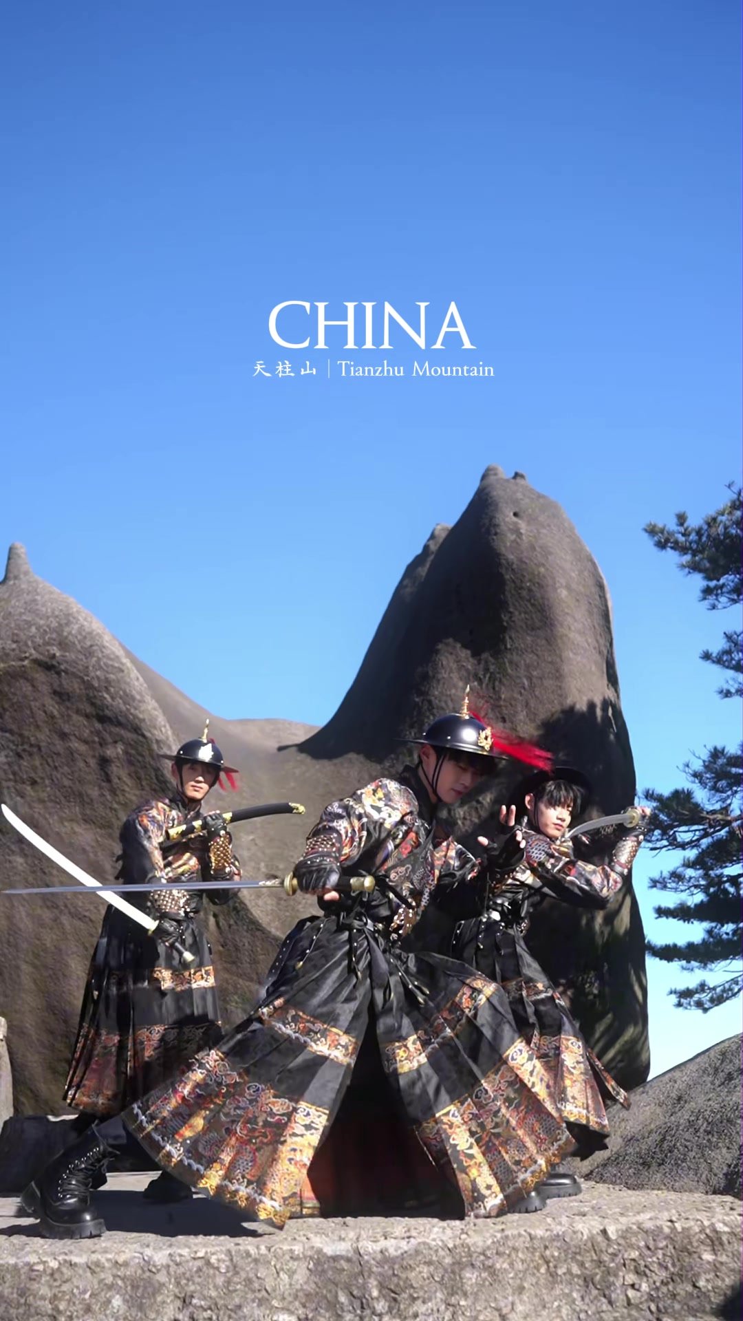 Traditionally dressed staff posing among Tianzhu Mountain’s granite peaks