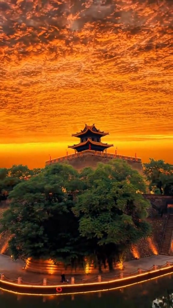 Historic architecture glowing above Xi’an as evening begins